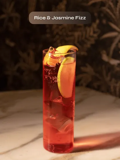 The Rice & Jasmine Fizz, a unique and floral sparkling cocktail.