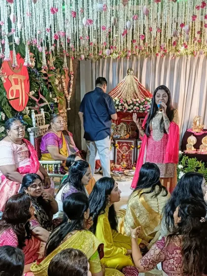 Here I am, mic in hand, guiding the flow of a traditional Simant ceremony. I make sure to explain the significance of the rituals while keeping the atmosphere light and celebratory.