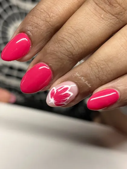 A bright pink base with a single, beautifully painted lotus accent nail.