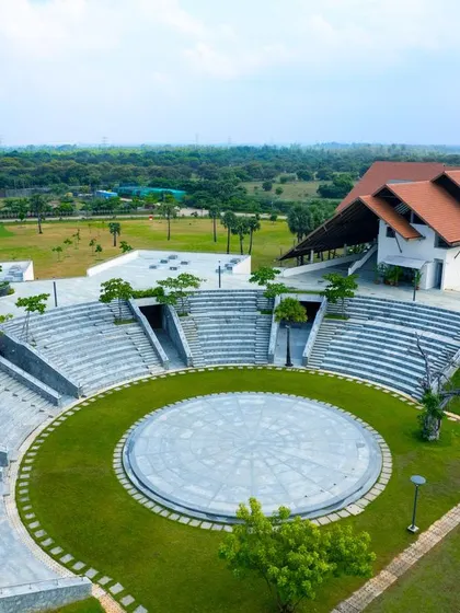A duplicate image of the large, open-air amphitheater at Vellore International School.