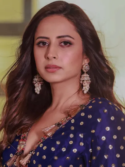 Sargun Mehta radiating star power during a promotional event, wearing my stunning jhumkas that add a touch of effortless glam.