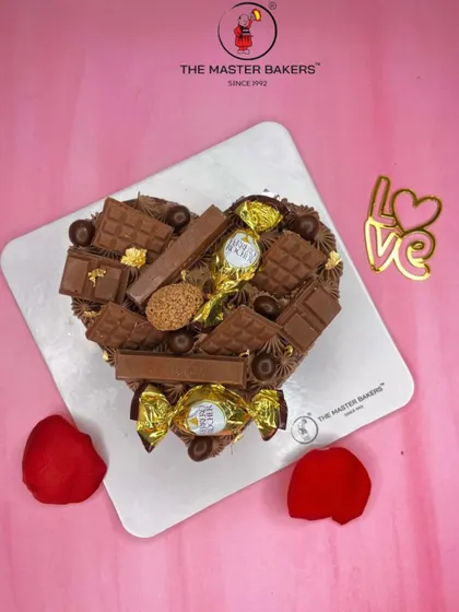 For the ultimate chocolate lover, this heart-shaped cake is loaded with an assortment of chocolates like Ferrero Rocher and KitKat. It's a truly decadent way to celebrate your love.