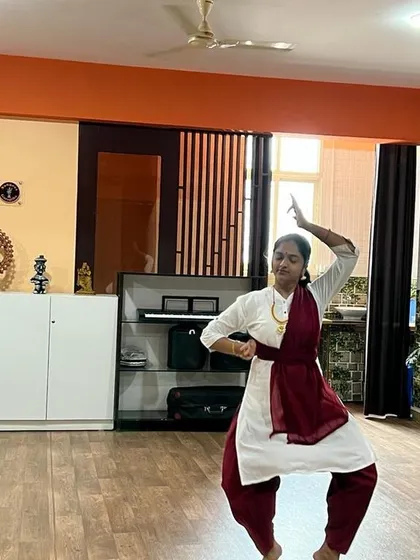 The focus and dedication of a Bharatanatyam student are evident in this practice shot. Each movement is practiced to perfection.