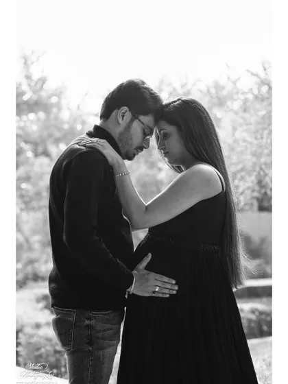 An intimate black and white portrait of a couple sharing a quiet moment. Removing the color helps focus entirely on the emotion and connection between them.