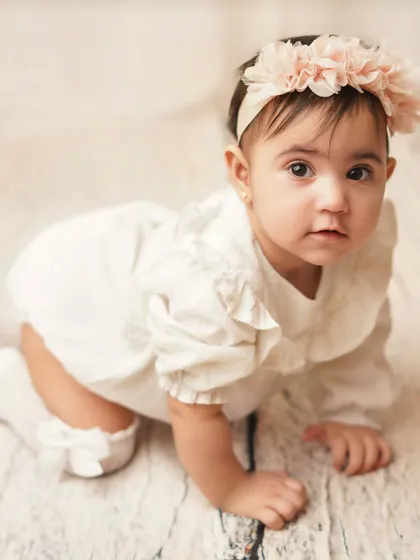 A curious expression from this little crawler. I love capturing the full range of emotions and expressions during a milestone shoot.