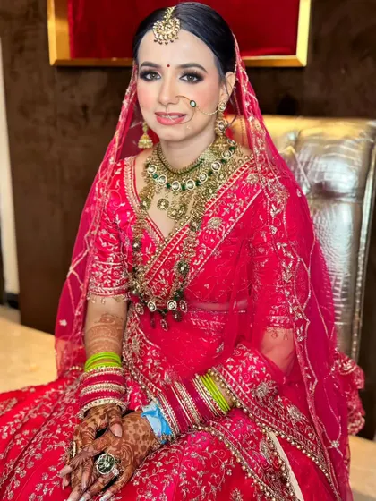 A seated portrait, capturing the bride's calm and happy demeanor on her special day.