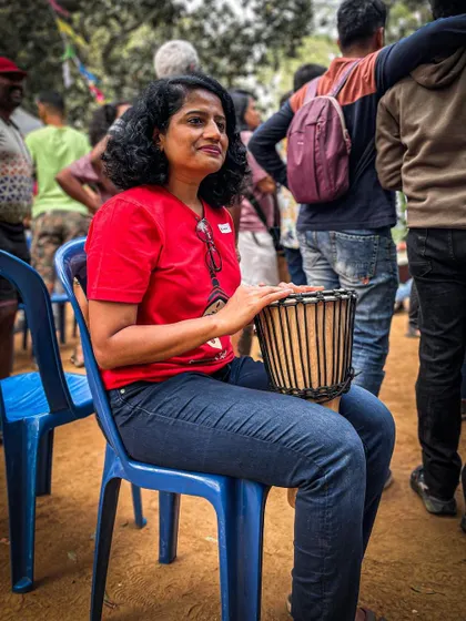 A member of our community enjoying the drum circle at the Garage Sale. The energy is infectious.