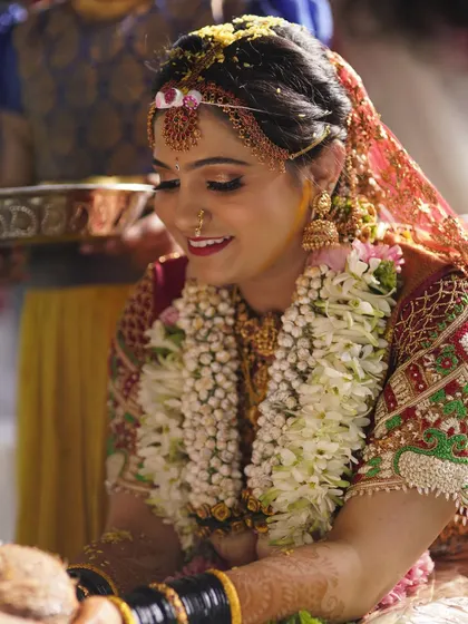 A candid moment from Deepika's muhurtham ceremony. Her makeup is designed to be water resistant and long lasting, ensuring she looks fresh and beautiful throughout the rituals.