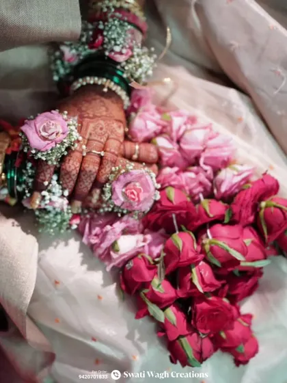 The intricate details of the rose petal kalire. Each flower is carefully attached to create a lush and beautiful accessory that every bride will love.