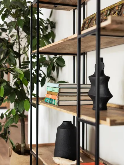Detail of a bookshelf in the 'Ikigai Living' project. We use open shelving not just for storage, but as a way to display personal items and add character to a room.