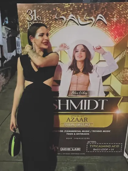 Posing with our New Year's Eve party poster in India. It was a great way to welcome 2024.