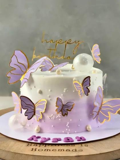A delicate butterfly theme on a lavender ombre cake, showcasing my signature simple and flavourful style. This is a 1kg Cherry Chocolate Mousse cake.