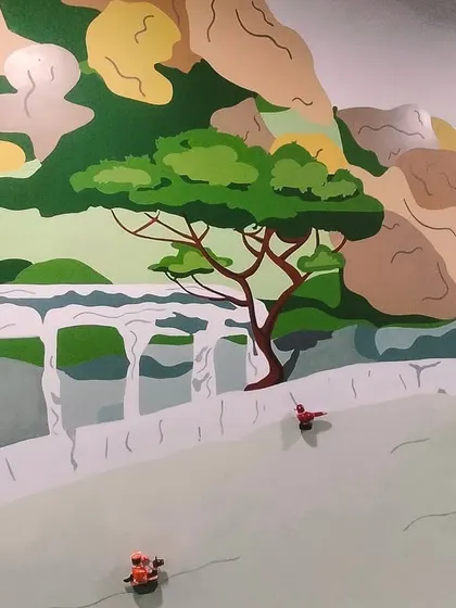 A detail of the MIPL corporate mural, showing the Anekal Gudi dolls against a backdrop of Bangalore's landscape. It’s a tribute to the city's roots.