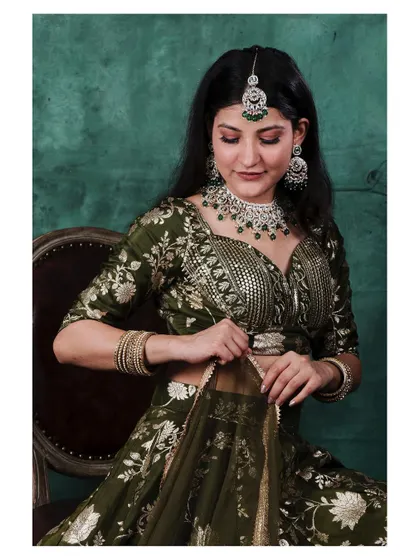 A closer view focusing on the details of the lehenga blouse and the diamond jewelry set. This shot highlights the craftsmanship of the entire ensemble.