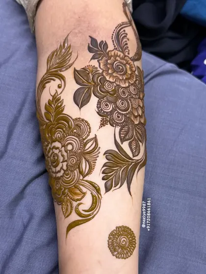 A collection of different floral motifs on the arm. This shows how I can create multiple small designs for a group of friends.