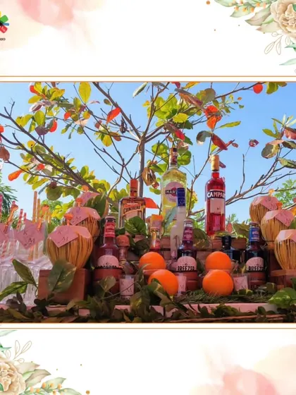 A vibrant bar setup under a tree, perfect for an outdoor brunch or garden party.