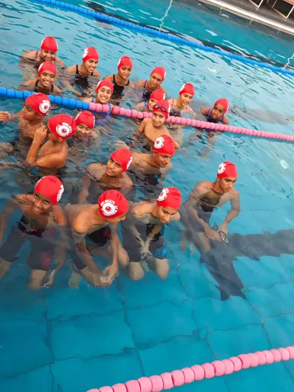 A great group shot of our swimmers in their team caps. It's all about being part of something bigger than yourself.