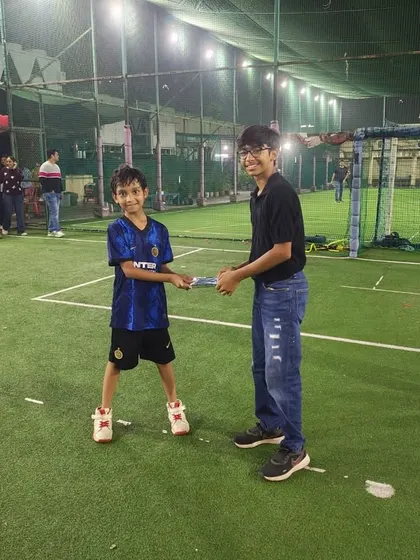 The birthday boy receiving a special prize. We make sure the guest of honor feels extra special on their big day.