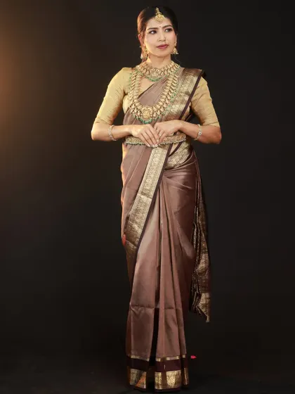 A direct, full-length view showing the complete look. This type of shot is essential for portfolios, clearly presenting the saree, blouse, and full jewellery set.