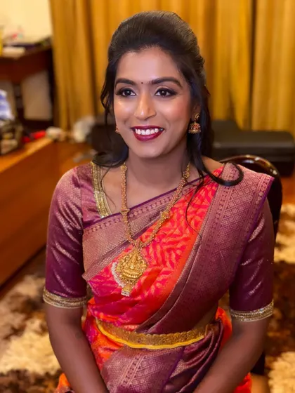 A powerful yet elegant look for IPS officer Rakshitha for a pre-wedding event. I was honored to create this smokey eye and bold lip for her.