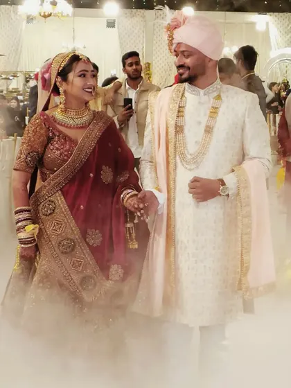 The couple walks hand-in-hand after their ceremony, surrounded by the happy glow of their celebration and the magic of the moment.