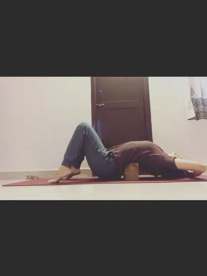 A yoga block can be a wonderful tool for opening the chest and shoulders. Placing a block under your upper back in a supported fish pose helps counteract the effects of slouching and creates space for deeper breathing.