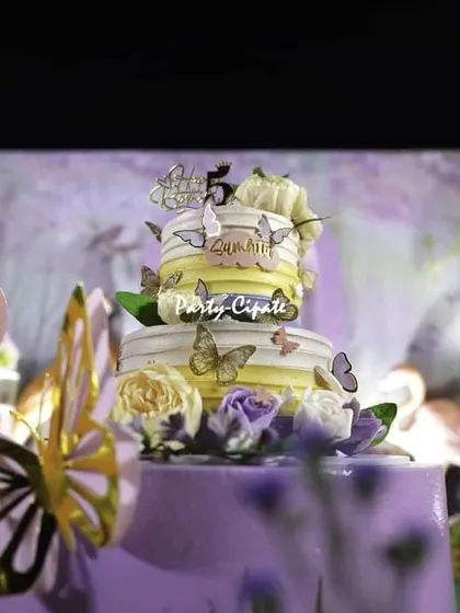 The stunning butterfly-adorned cake for Samhita's 5th birthday. The cake itself is a work of art and a central part of the celebration's decor.