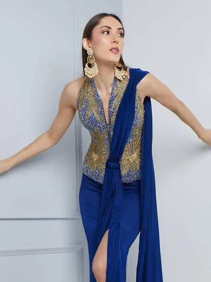 A close-up of the embellished bodice and elegant drape of the dress from The Luxury Pop.