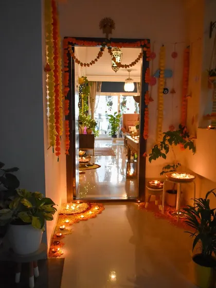 The entryway, all decked up for Diwali with marigold garlands and a flower rangoli. This is the perfect welcome for guests.