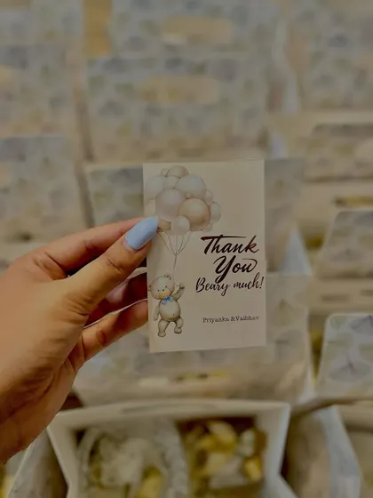 A close-up of the custom "Thank You Beary Much" tag we created for a teddy bear themed baby shower.