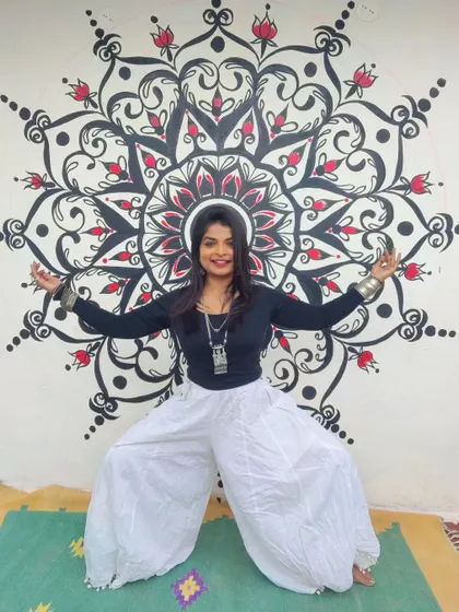 Another pose in front of the completed mandala. The scale of the piece makes it a powerful statement in any room.