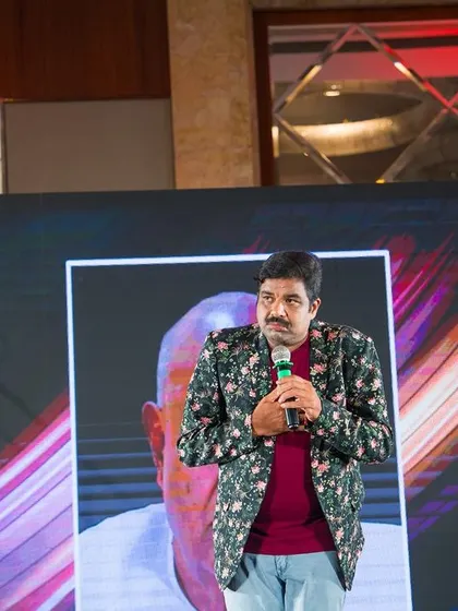 A solo performance during the Indian Oil event, where I did a mimicry act. The background shows the international theme of the event.