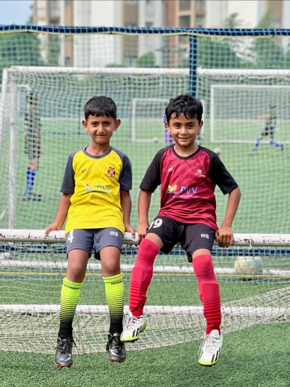 Friendships on and off the field. Two of our young players enjoying a moment together during a break in training.