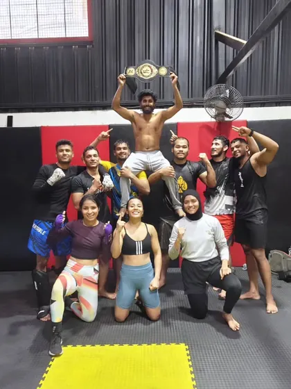 This is what our team is all about. We celebrate every victory, big or small, like family. Here we are lifting up our newly crowned champion, Shahid, after his incredible win. When you join us, you join a legacy of fighters.