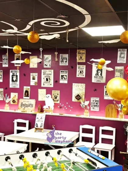 I transformed the party room into the Great Hall, with floating 'winged keys' and 'golden snitches' hanging from the ceiling. The walls were decorated with 'wanted' posters from the wizarding world.