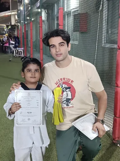 This student has earned her yellow belt. Congratulations on taking the next step in your Taekwondo journey.