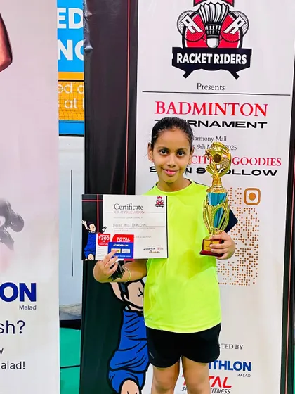 Kashvi with her Under-11 title trophy from the Racket Riders tournament. Her consistent performance across different events is a result of disciplined practice.