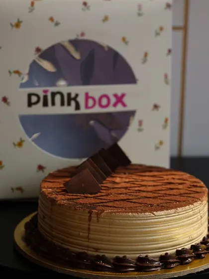 Our Coffee Mocha cake is perfect for coffee lovers. This eggless cake features layers of coffee-infused sponge and cream, dusted with cocoa powder for that classic tiramisu look.