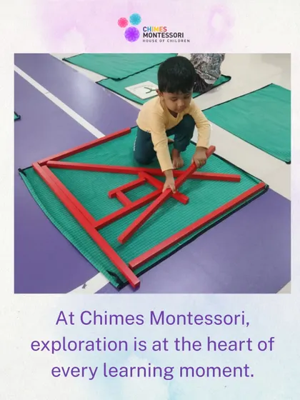 Design thinking starts early here. A child uses the classic Montessori Red Rods to create his own geometric pattern, moving beyond the initial lesson to explore his own creativity.