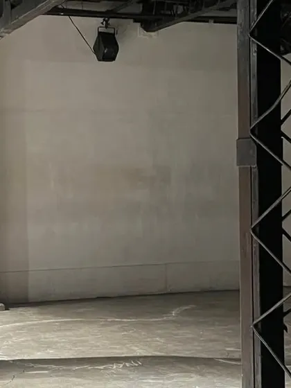 A wider view of a moment of introspection during a solo performance. Even in solitude, the body can fill a space with story and emotion, a theme central to my work.