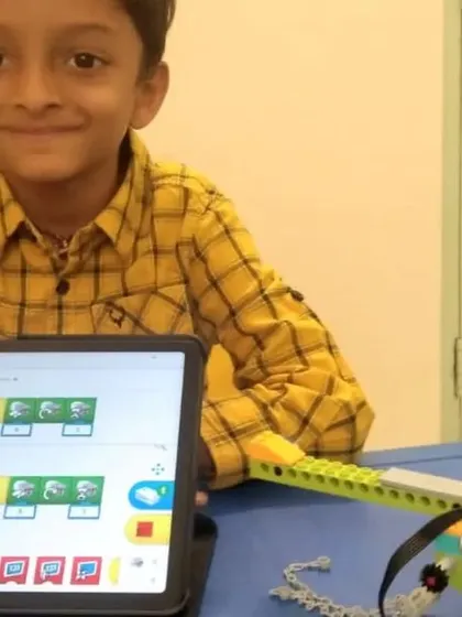 This student is focused on the coding interface, programming his helicopter to perform a sequence of actions.