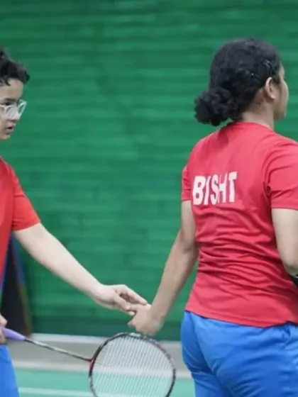 A candid moment of partnership between two of our players during the CBSE Nationals. We emphasize teamwork and mutual support on and off the court.