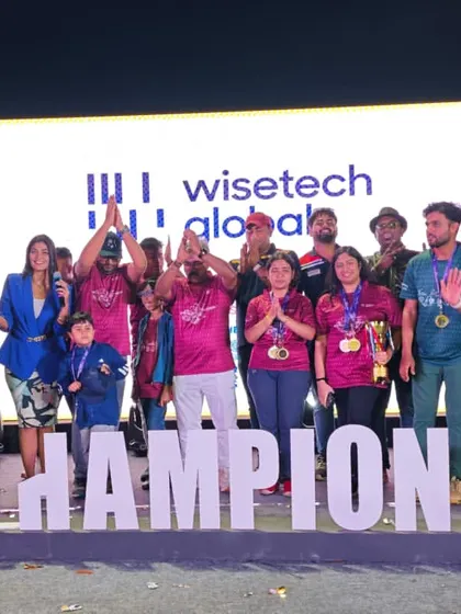 The winning team celebrates on stage. My production, including the "CHAMPIONS" sign and LED backdrop, adds to the excitement of the moment.