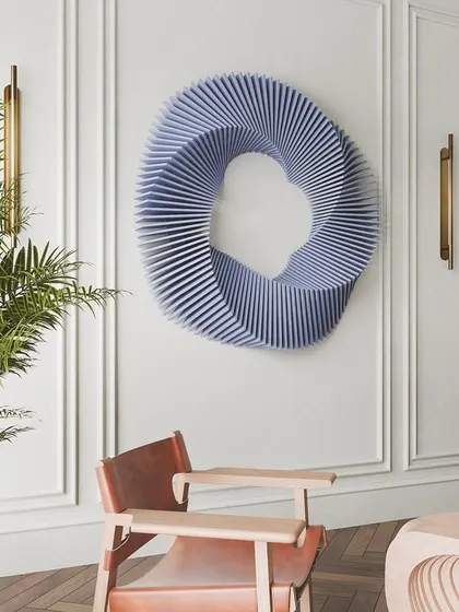Our modern wavy wooden art in a classic living room with wall molding. The contemporary form of the sculpture creates a beautiful contrast with the traditional architecture.