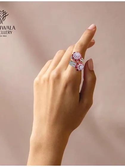 A whimsical and elegant ring with swirling patterns of rubies and diamonds. This piece is designed to be both playful and luxurious, a perfect expression of joyful celebration.