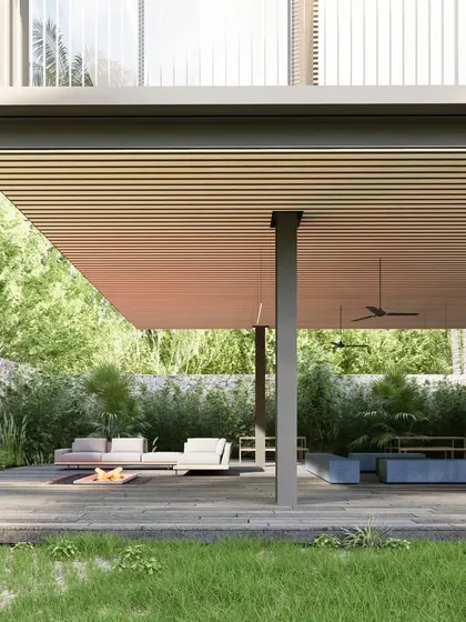 The lower level of the clubhouse is a semi-open lounge area, perfect for relaxing by the water. The design provides shelter from the sun while maintaining a direct connection to the surrounding greenery and landscape.