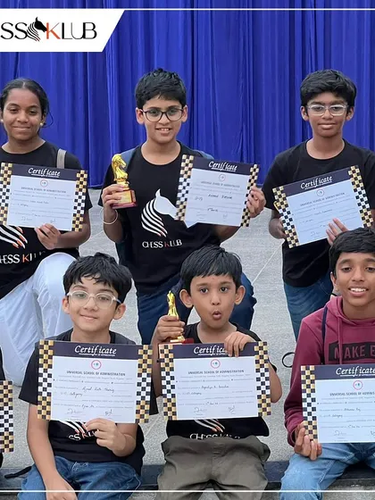 Our talented students proudly display their certificates and trophies after a successful run at the Universal First Age Category Children Chess Tournament.