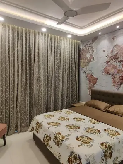 A well-designed room should have space for your passions. We ensured this bedroom layout included a cozy corner for our client to relax with their guitar, demonstrating how we incorporate personal lifestyle elements into our interior designs.