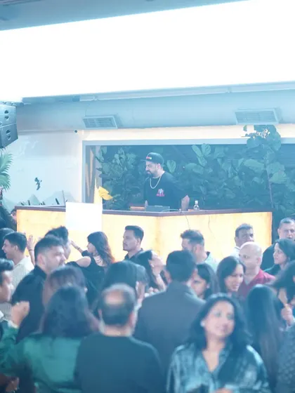 A wide shot showing me on the decks overlooking the packed crowd at Pangeo.