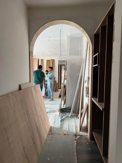 A view through the chaos. This arched doorway, seen from a hallway filled with construction materials, already hints at the main character energy it will bring to the finished space.